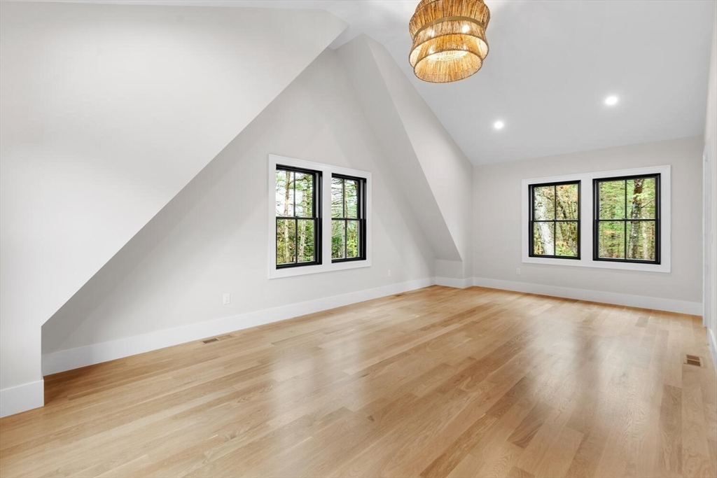 969 South Street Needham, MA 02492 - Photo 19 of 32 an empty room with windows and mirror