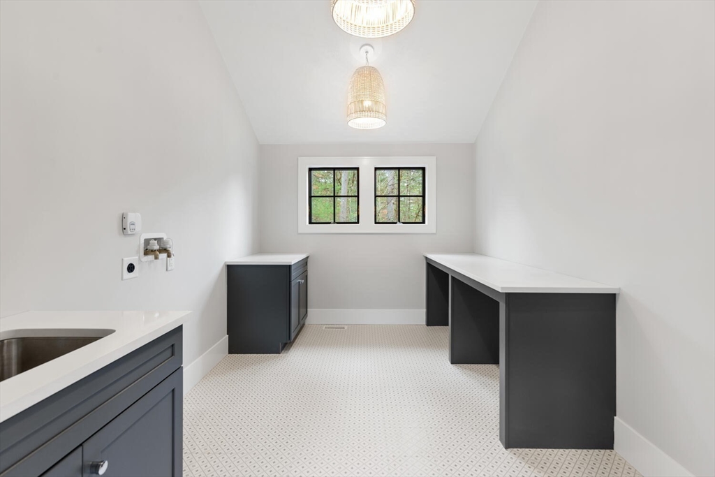 969 South Street Needham, MA 02492 - Photo 21 of 32 a kitchen with a refrigerator and a sink