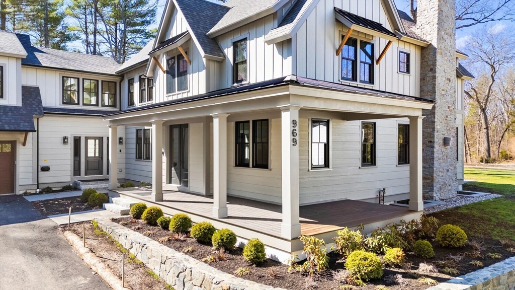 969 South Street Needham, MA 02492 - Photo 25 of 32 front view of a house with a yard