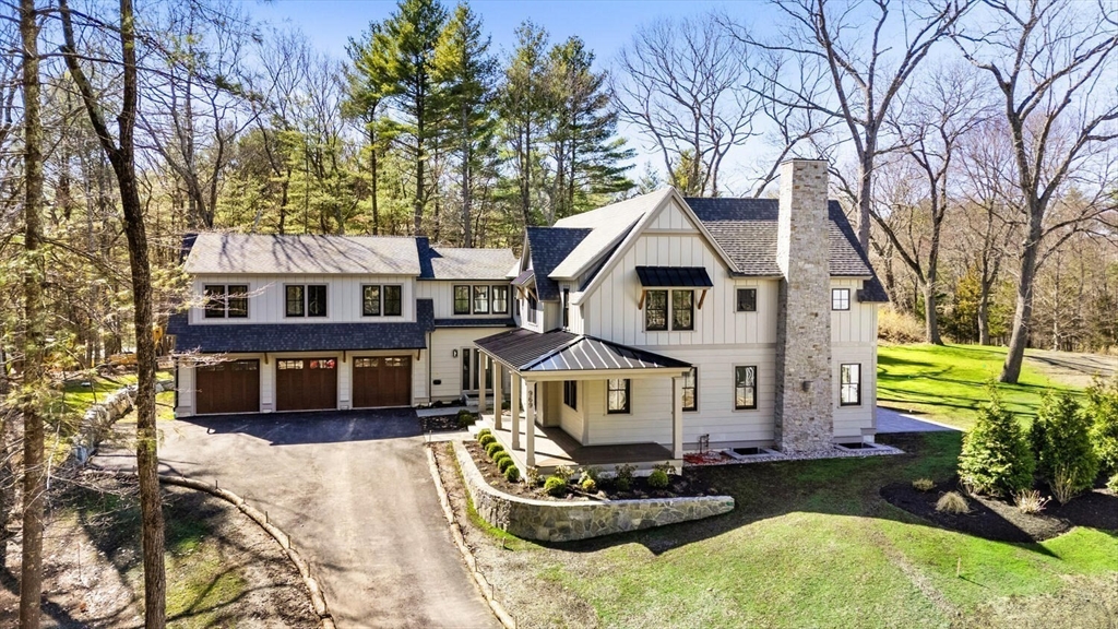 969 South Street Needham, MA 02492 - Photo 26 of 32 a front view of a house with a yard