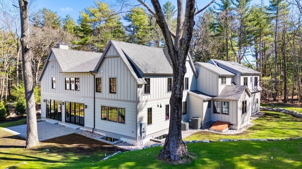 969 South Street Needham, MA 02492 - Photo 27 of 32 front view of a house with a yard