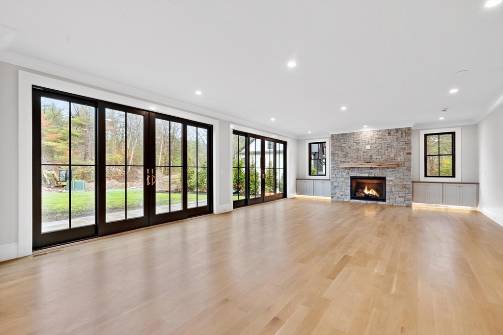 969 South Street Needham, MA 02492 - Photo 3 of 32 a view of an empty room with a fireplace and a window