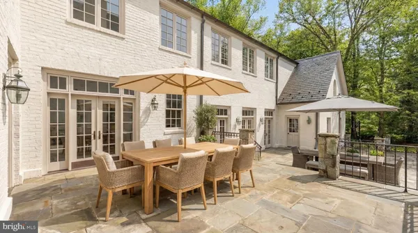 a view of a dinning table and chairs in the patio