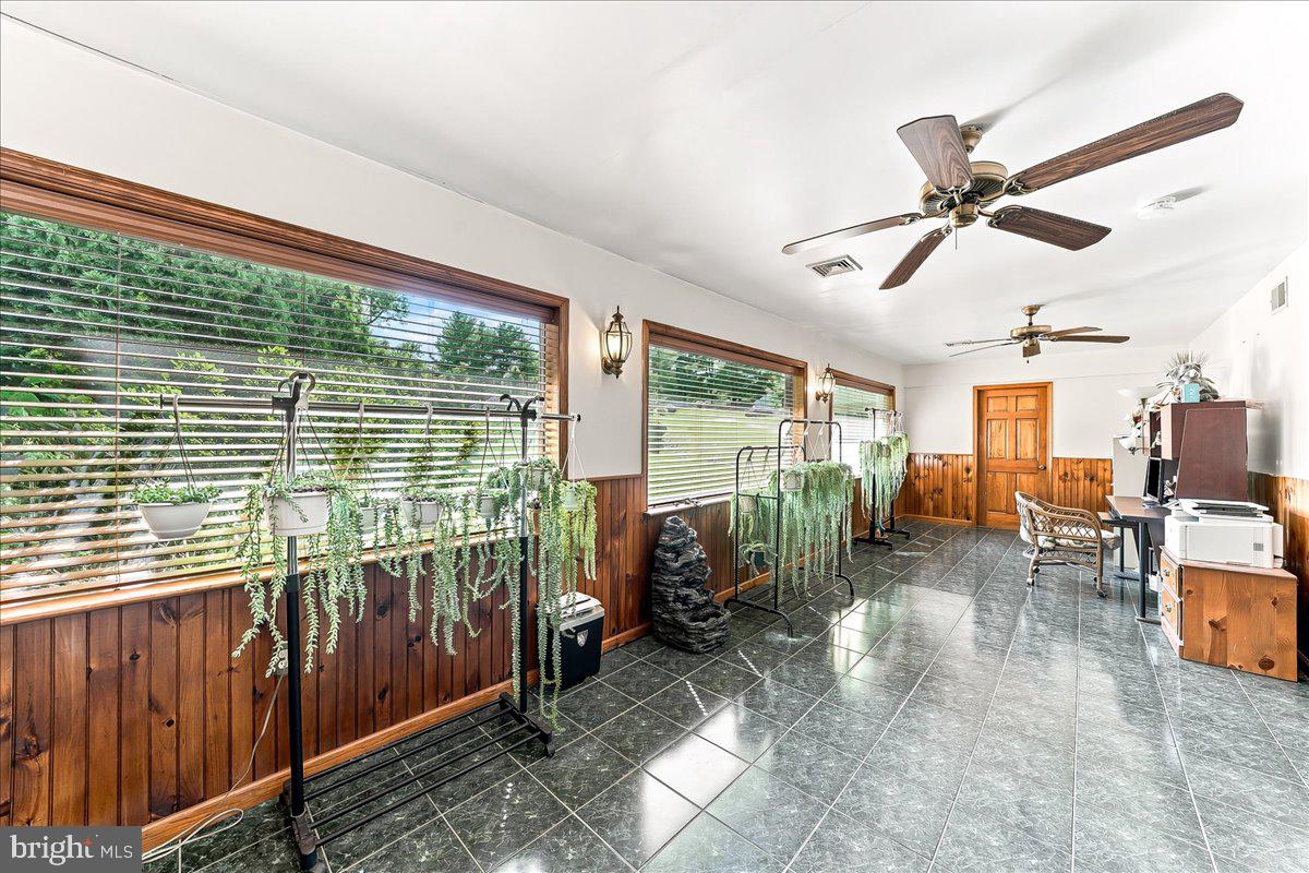 468 Kirks Mill Road Nottingham, PA 19362 - Photo 15 of 48 Bright, airy sunroom with greenery.