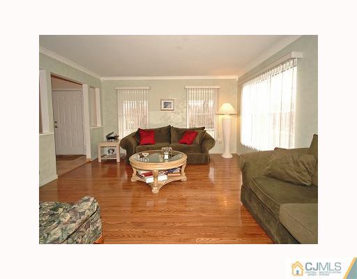 5 Crescent Road Old Bridge, NJ 08857 - Photo 3 of 8 a living room with furniture and a window