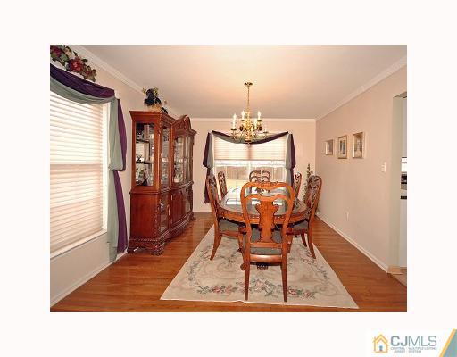 5 Crescent Road Old Bridge, NJ 08857 - Photo 4 of 8 a dining room with furniture and chandelier kitchen view