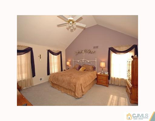 5 Crescent Road Old Bridge, NJ 08857 - Photo 8 of 8 a living room with a bed furniture and a window