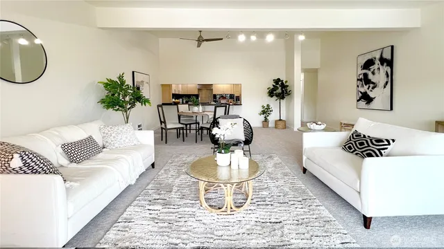 a living room with a couch and a potted plant