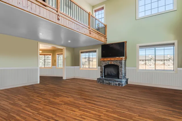 a living room with fireplace furniture and a flat screen tv