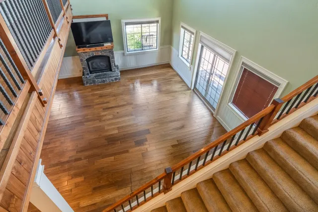 a view of an entryway with wooden floor