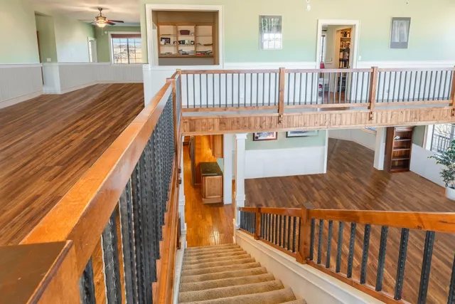 a bedroom with furniture and wooden floor
