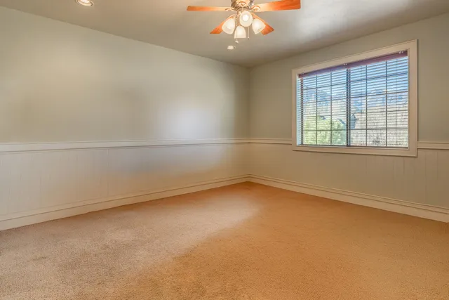 an empty room with a empty space and windows