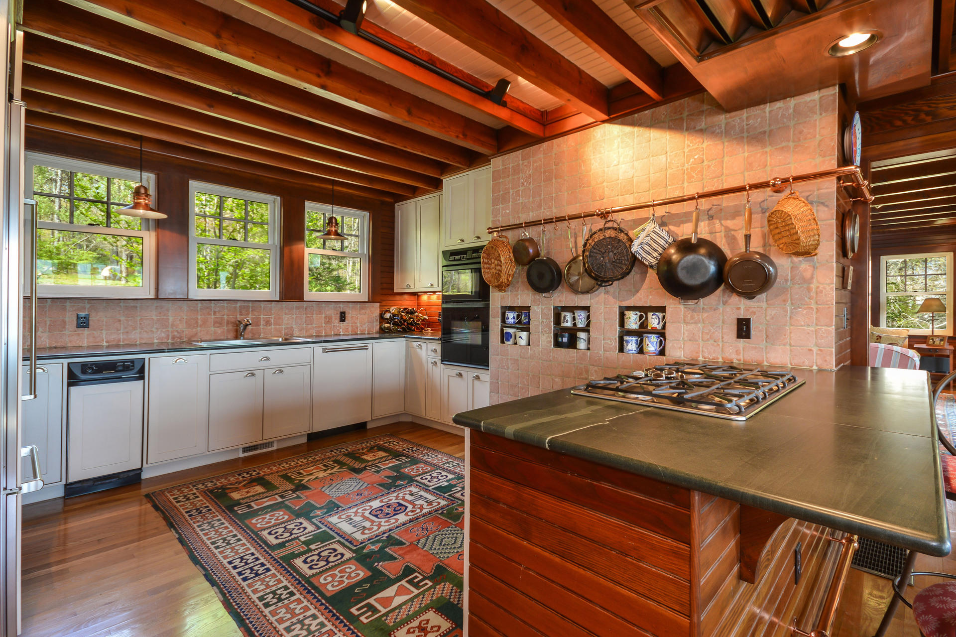 438 Scraggy Neck Road Cataumet, MA 02534 - Photo 11 of 33 a kitchen with stainless steel appliances granite countertop a sink window and cabinets