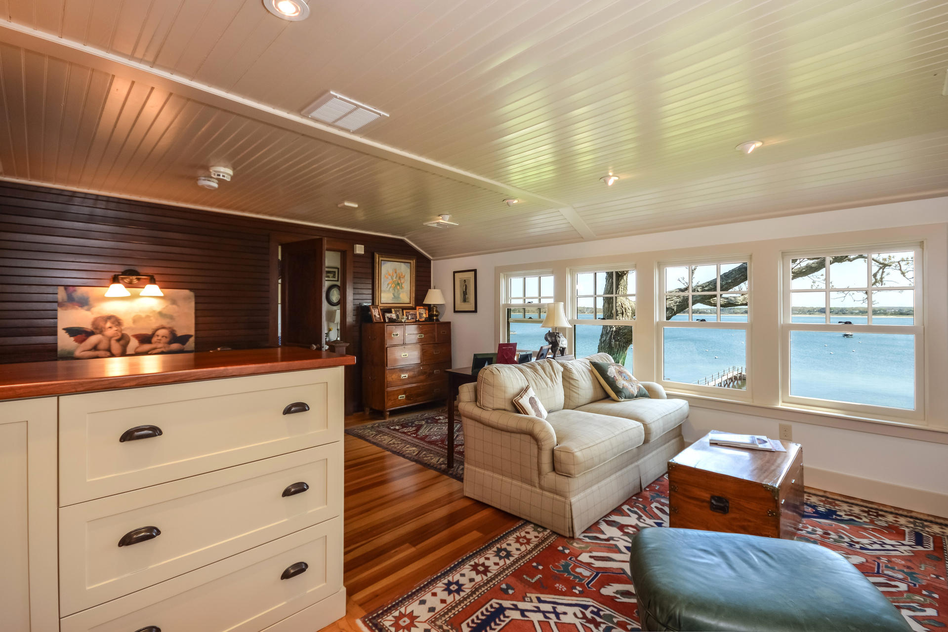 438 Scraggy Neck Road Cataumet, MA 02534 - Photo 16 of 33 a living room with furniture and a flat screen tv