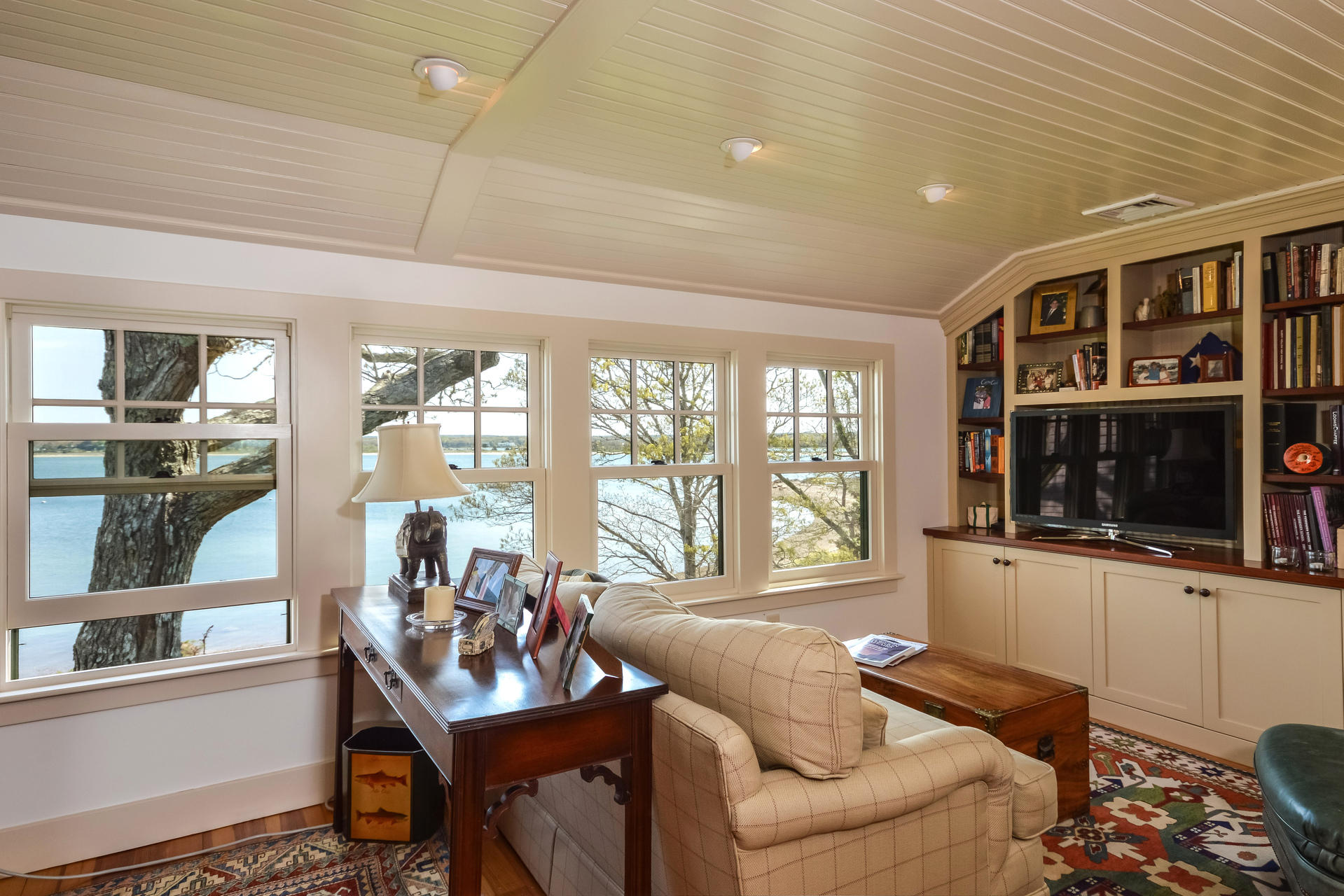 438 Scraggy Neck Road Cataumet, MA 02534 - Photo 17 of 33 a living room with furniture and a flat screen tv