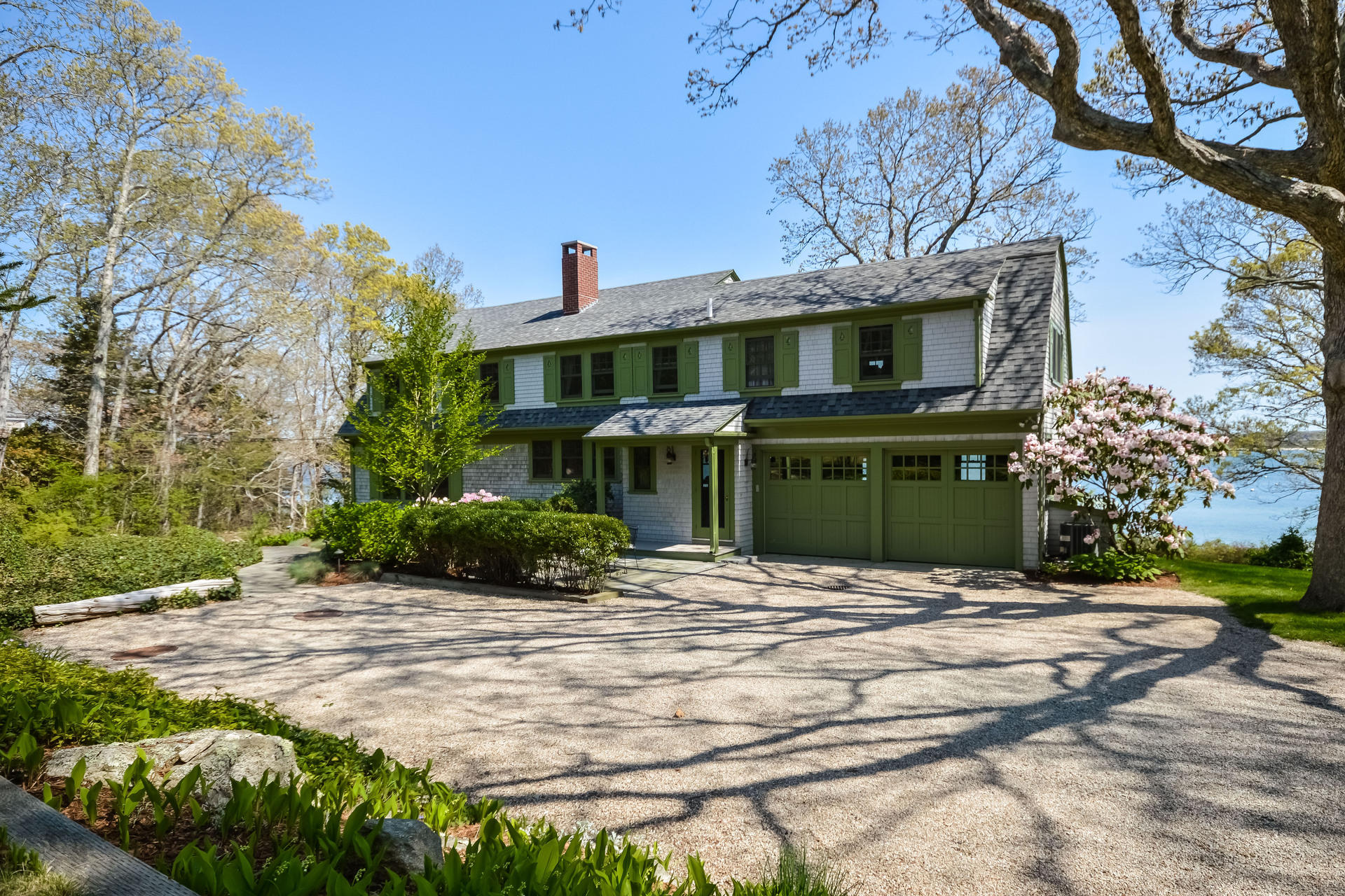 438 Scraggy Neck Road Cataumet, MA 02534 - Photo 24 of 33 a front view of a house with a garden