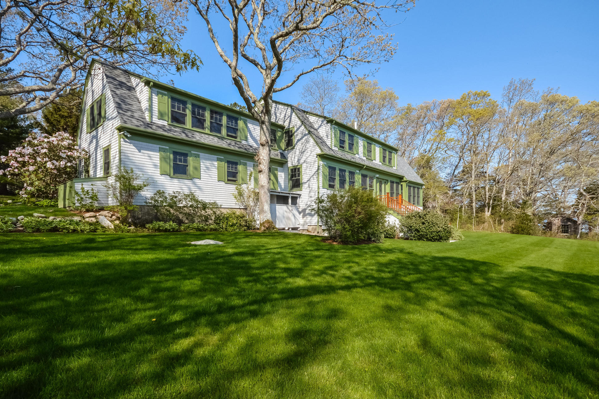 438 Scraggy Neck Road Cataumet, MA 02534 - Photo 25 of 33 a front view of a house with a garden