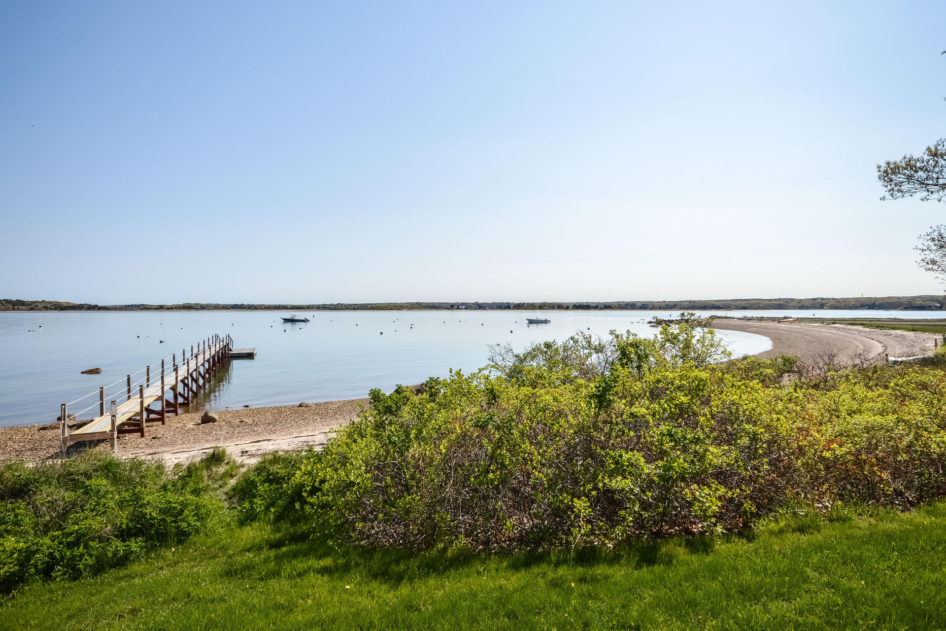 438 Scraggy Neck Road Cataumet, MA 02534 - Photo 26 of 33 a view of a lake with a yard