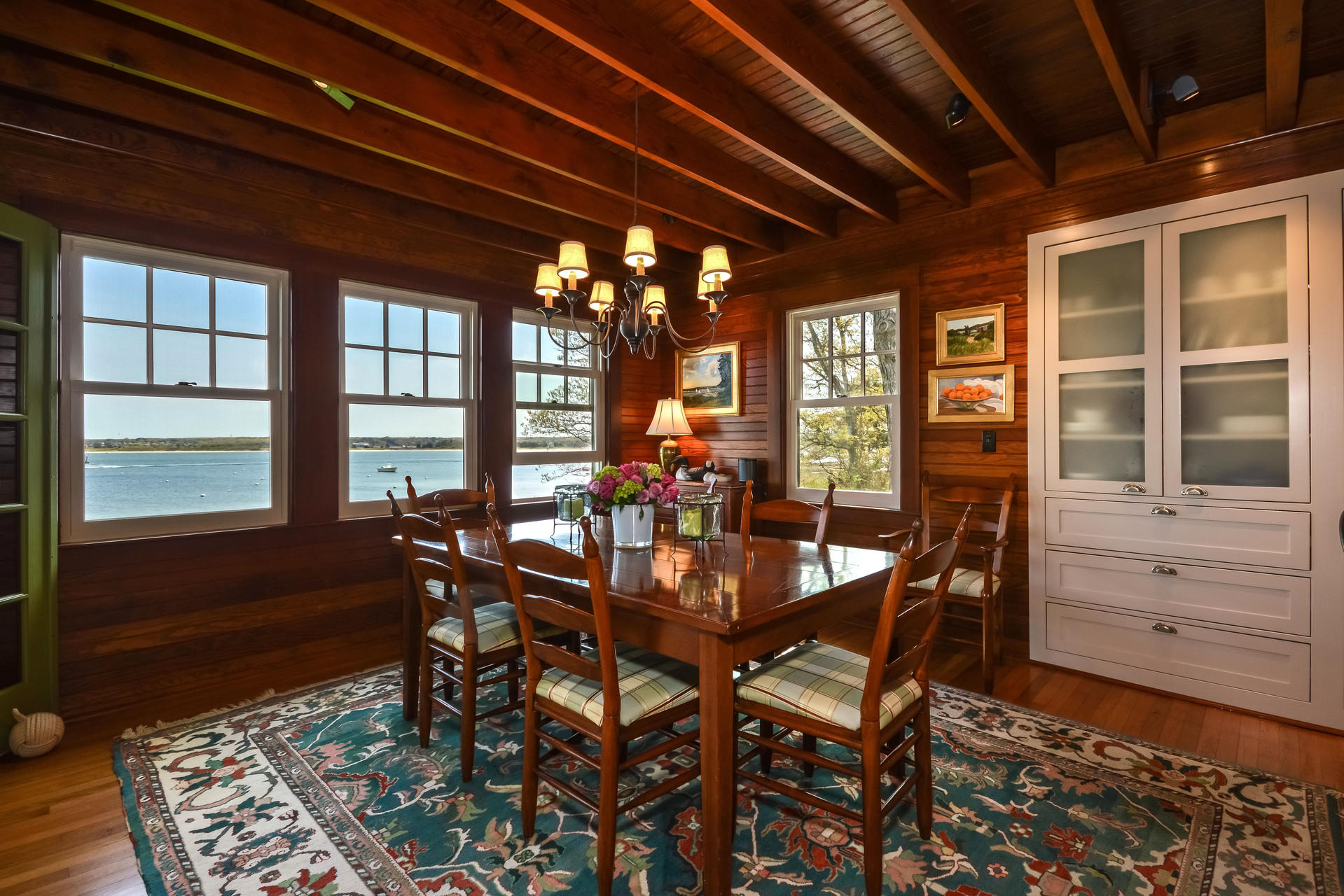 438 Scraggy Neck Road Cataumet, MA 02534 - Photo 10 of 33 a view of a dining room with furniture window and outside view