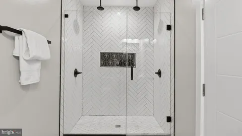 a bedroom with bed and a window