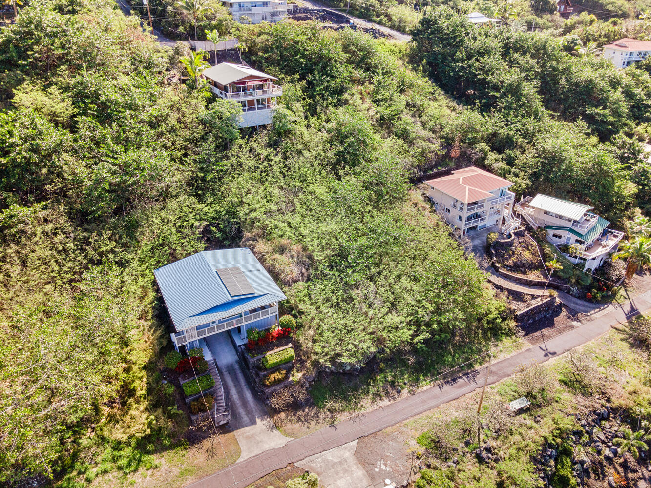 146 Fern Road Captain Cook, HI 96704 - Photo 1 of 14 an aerial view of a house with a yard
