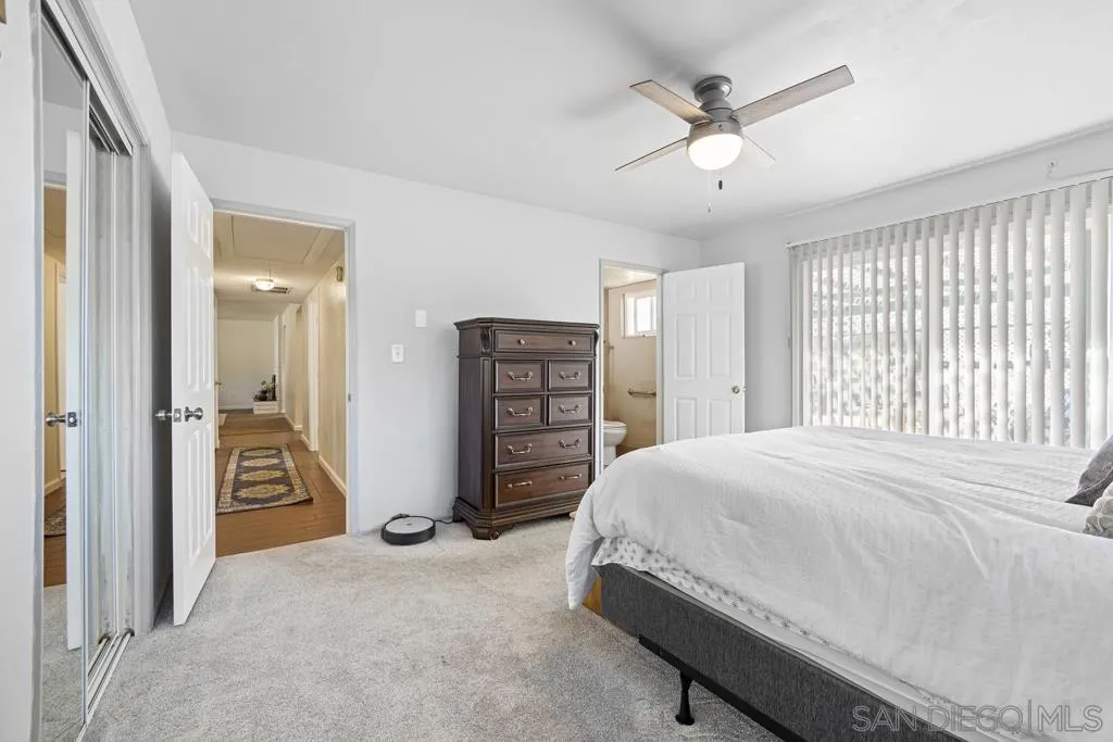 1007 Pepper Tree Lane Fallbrook, CA 92028 - Photo 16 of 34 a bedroom with a bed and a walk in closet