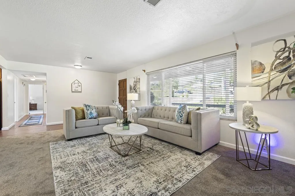 1007 Pepper Tree Lane Fallbrook, CA 92028 - Photo 2 of 34 a living room with furniture and a large window