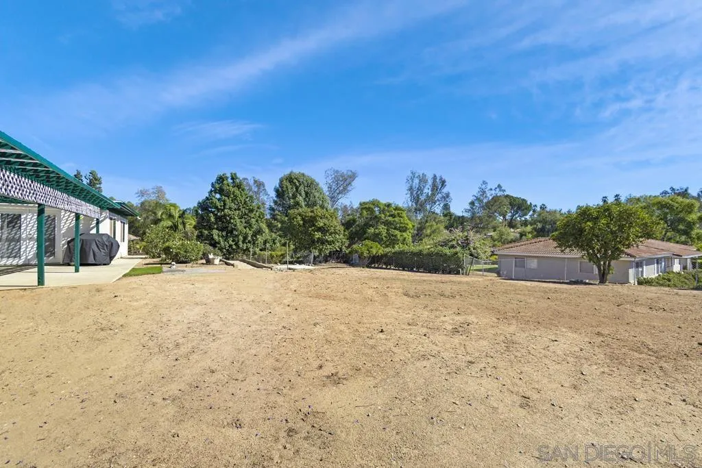1007 Pepper Tree Lane Fallbrook, CA 92028 - Photo 29 of 34 a view of a yard with a house