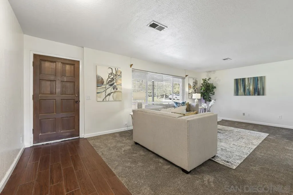 1007 Pepper Tree Lane Fallbrook, CA 92028 - Photo 5 of 34 a living room with furniture and a flat screen tv