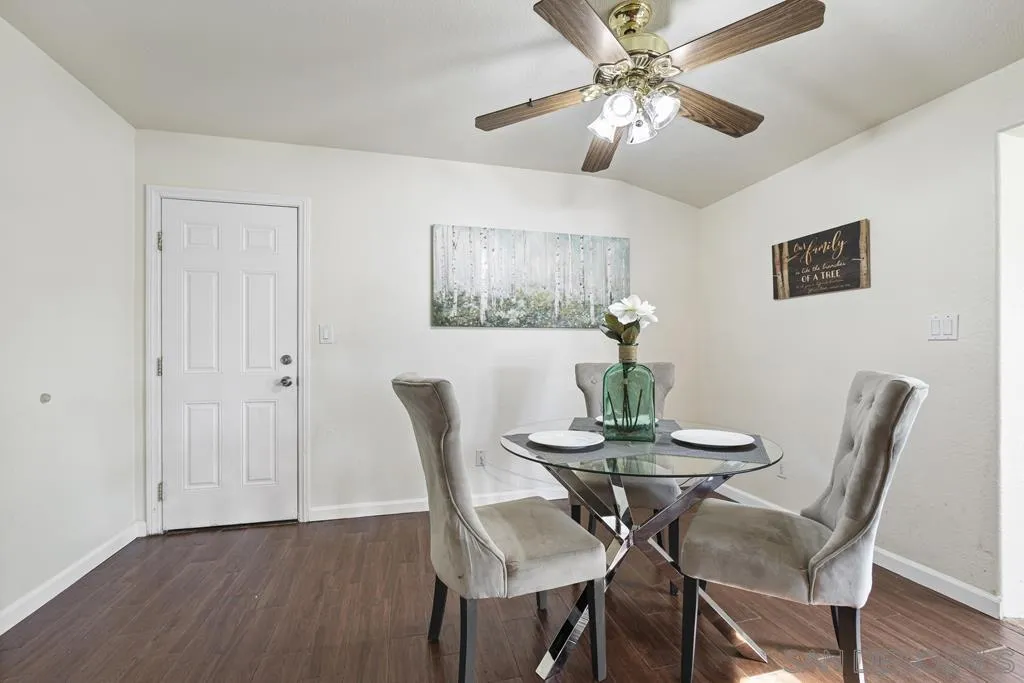 1007 Pepper Tree Lane Fallbrook, CA 92028 - Photo 8 of 34 a view of a dining room with furniture and wooden floor