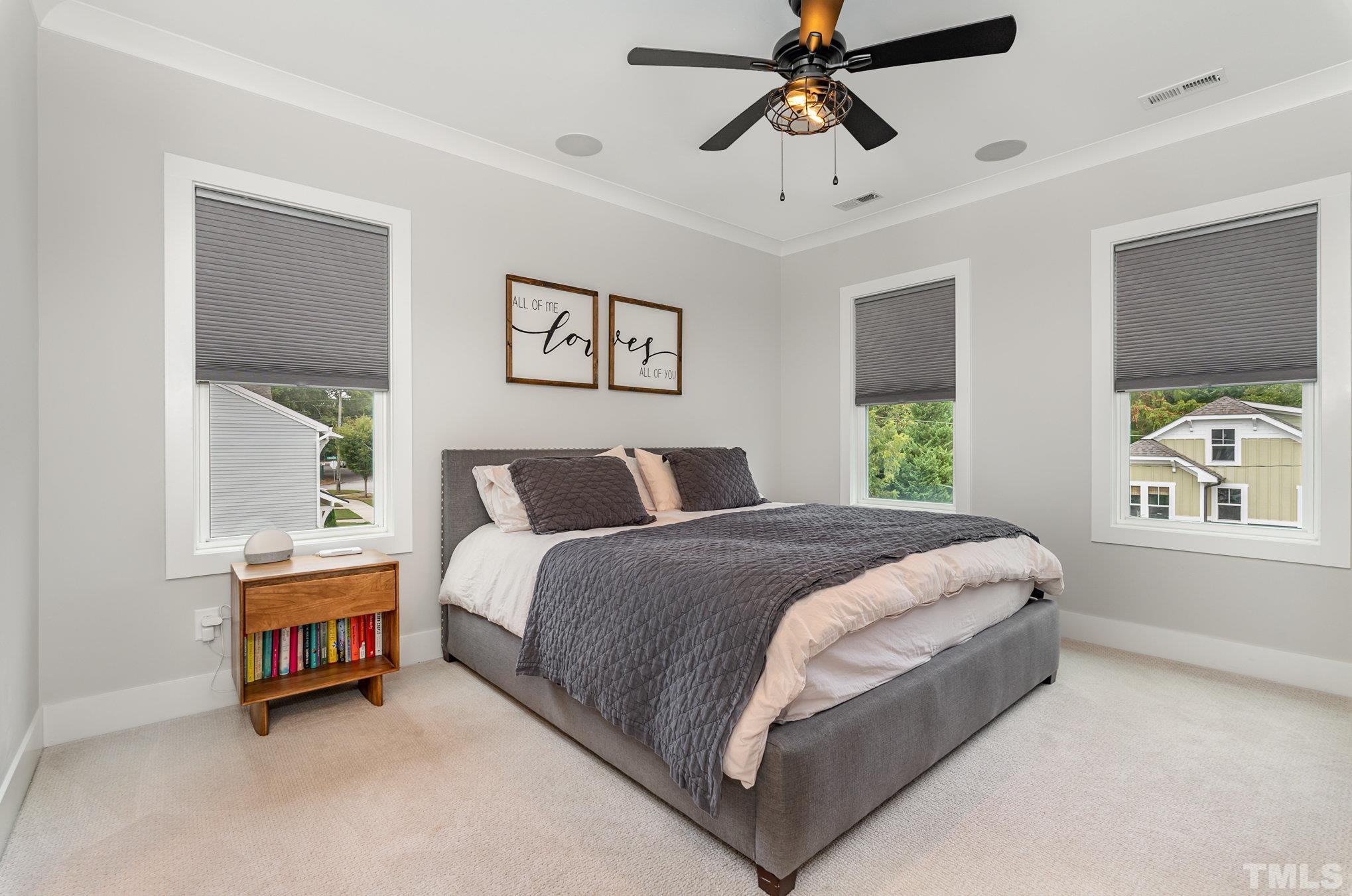 626 Watauga Street Raleigh, NC 27604 - Photo 11 of 30 a spacious bedroom with a bed and a window