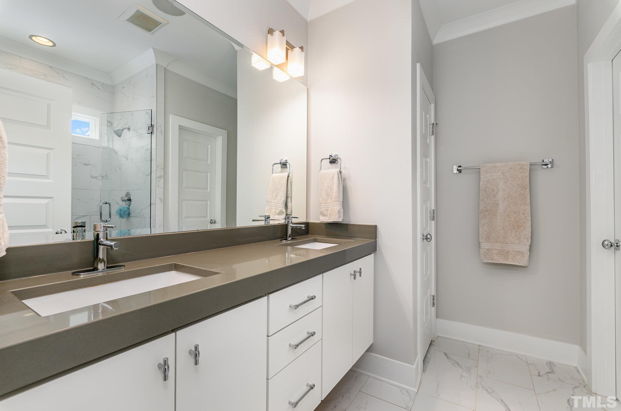 626 Watauga Street Raleigh, NC 27604 - Photo 14 of 30 a bathroom with a granite countertop sink and a mirror