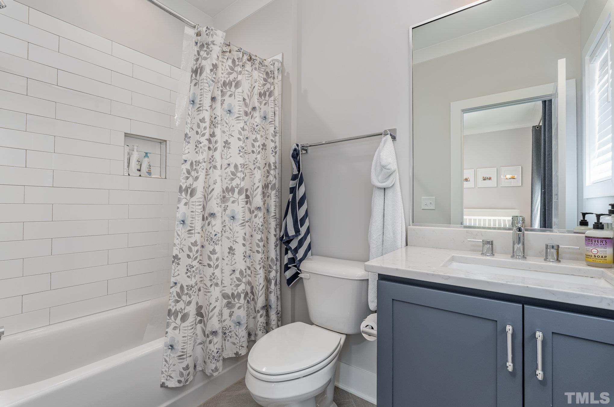 626 Watauga Street Raleigh, NC 27604 - Photo 18 of 30 a bathroom with a sink a toilet and shower