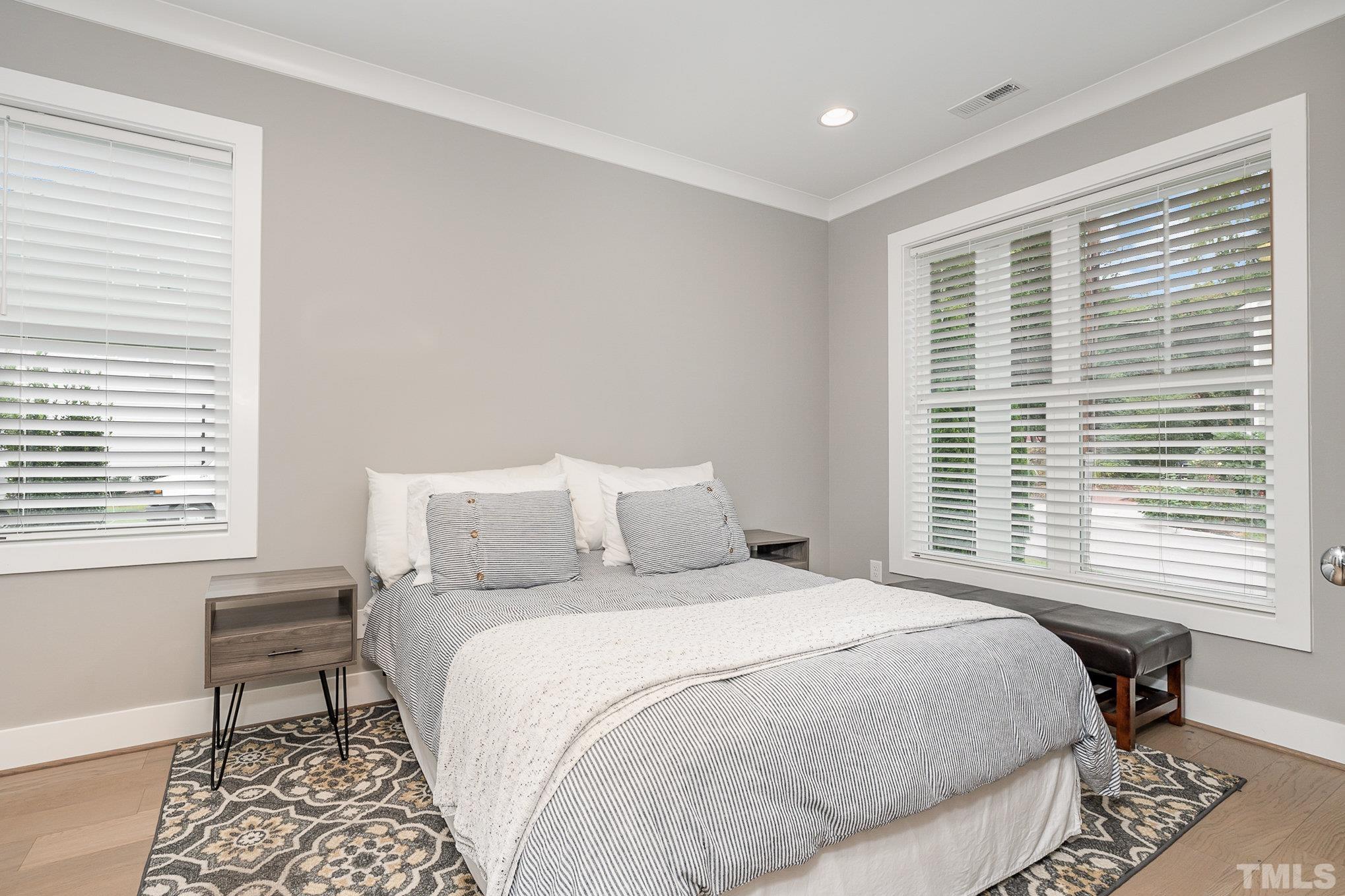 626 Watauga Street Raleigh, NC 27604 - Photo 20 of 30 a bedroom with a bed and a window