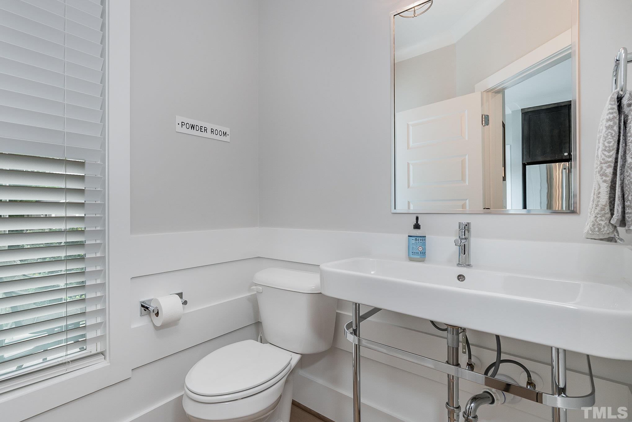626 Watauga Street Raleigh, NC 27604 - Photo 22 of 30 a bathroom with a sink a toilet and shower