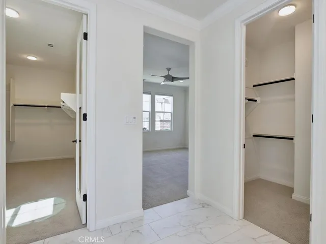 a bathroom with a double vanity sink mirror and bathtub