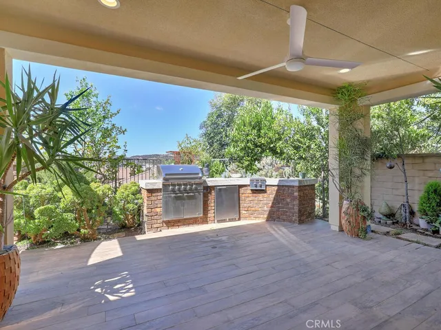 a view of a porch with wooden floor and a potted plant