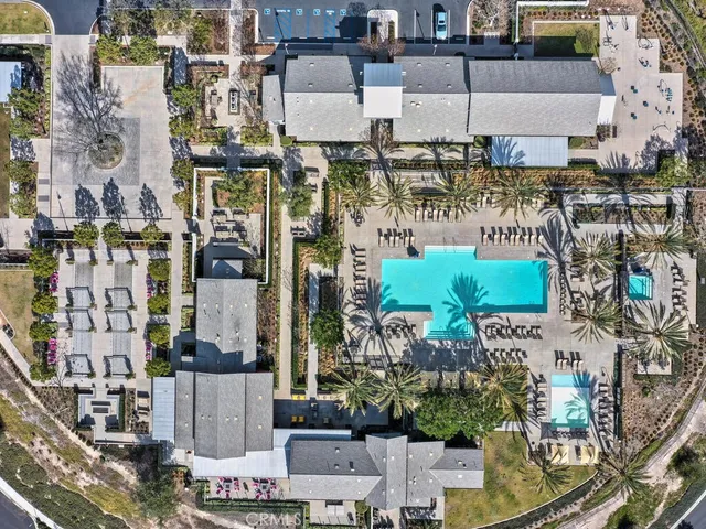 a view of a patio with table and chairs potted plants