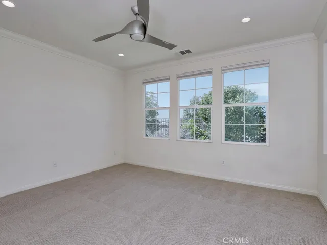 a kitchen with cabinets and stainless steel appliances