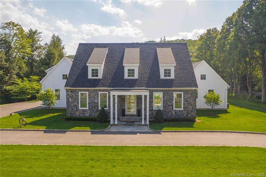 32 Davis Hill Road Weston, CT 06883 - Photo 1 of 1 a view of a big house with a big yard and large trees