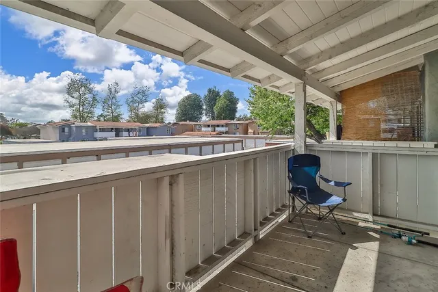 a view of a chairs and table in the balcony