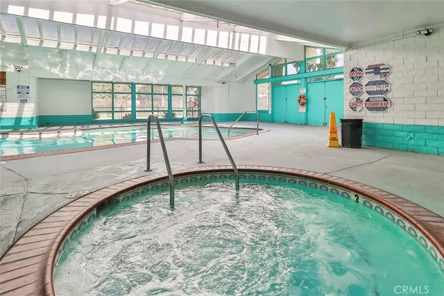a view of a living room and kitchen
