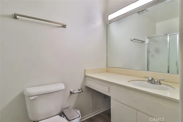 a bathroom with a sink toilet and vanity