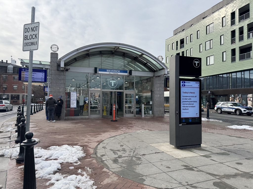 25-31 Maverick Square, Unit 5 Boston, MA 02128 - Photo 26 of 26 a front view of a building with parking