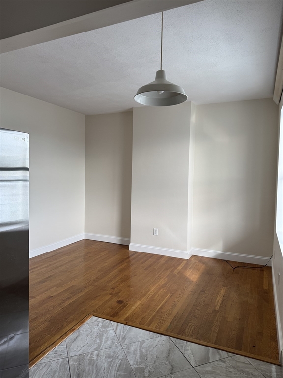25-31 Maverick Square, Unit 5 Boston, MA 02128 - Photo 8 of 26 a view of an empty room with wooden floor
