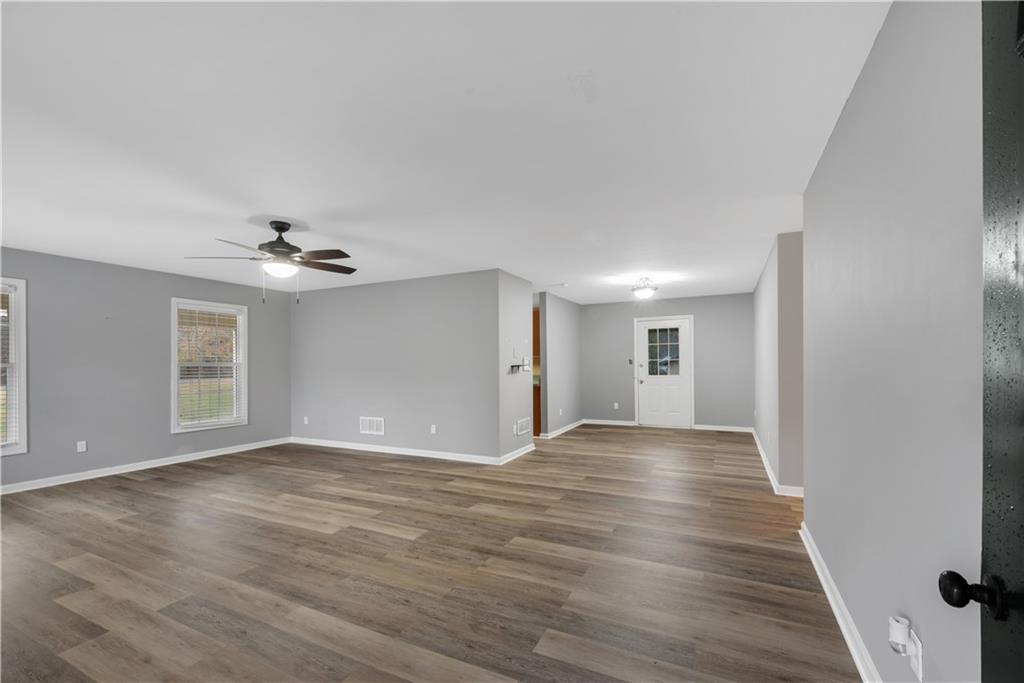 700 Tilley Road Talking Rock, GA 30175 - Photo 11 of 32 a view of empty room with wooden floor and ceiling fan