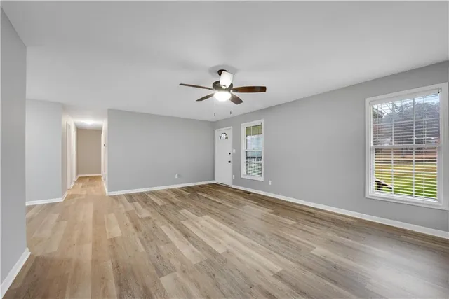a view of an empty room with a window