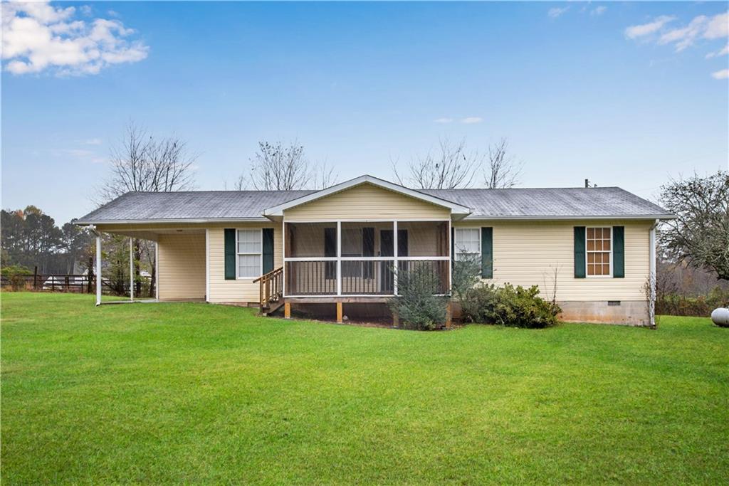 700 Tilley Road Talking Rock, GA 30175 - Photo 2 of 32 a front view of a house with a yard