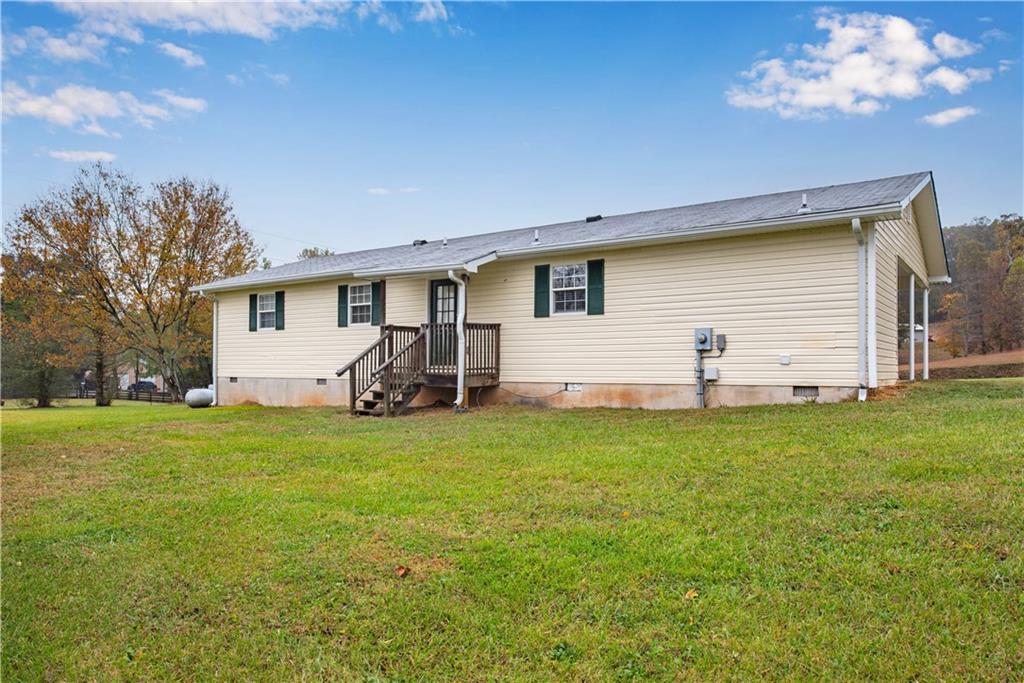 700 Tilley Road Talking Rock, GA 30175 - Photo 29 of 32 a view of a backyard with a garden