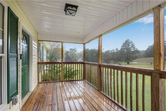 a view of a balcony with wooden floor